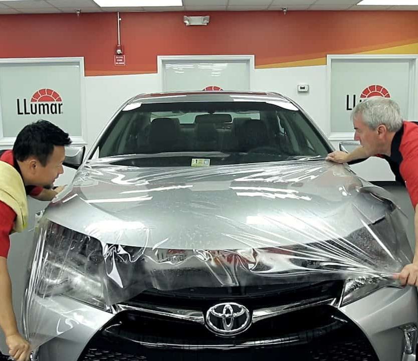 Precision Window Tint 12 Paint protection film being installed on car in Henderson